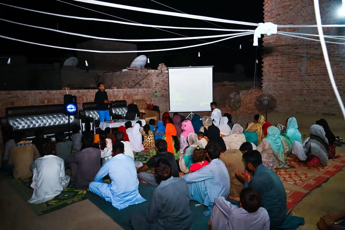 The projector set up, the screen raised and the mats filling